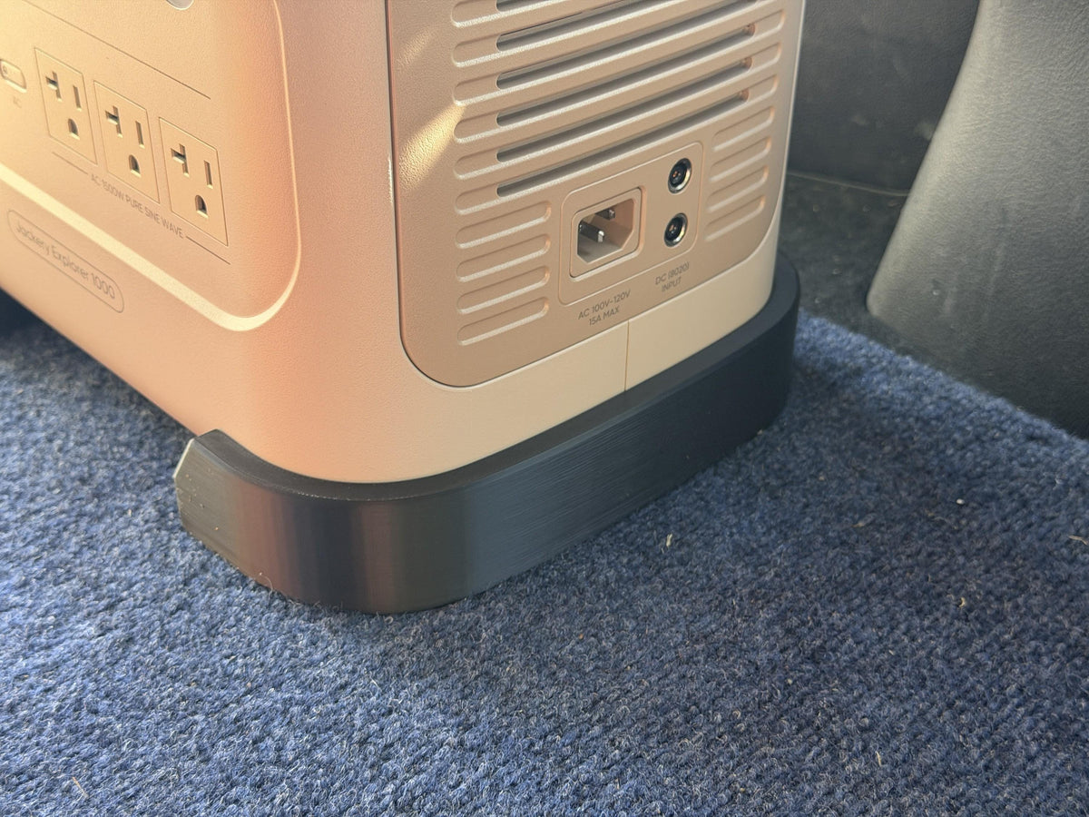 Rear corner of the Jackery in its rail, with the rear ports left clear