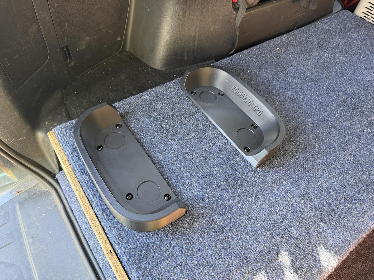 Both rails screwed down to a carpeted cargo platform, ready for the Jackery