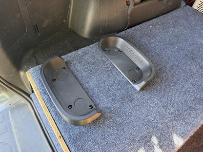 Both rails screwed down to a carpeted cargo platform, ready for the Jackery